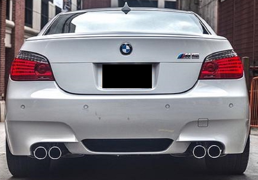 BMW M5, model year 2005-, black, driving, diagonal from the back, rear  view, test track Stock Photo - Alamy